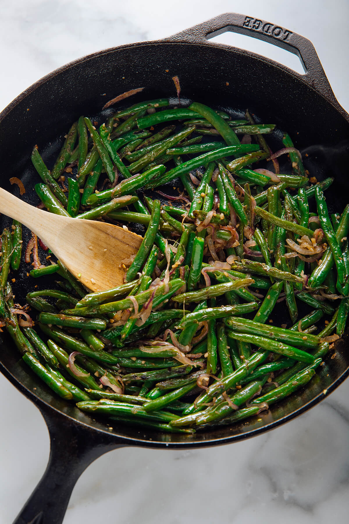 green beans cooked with red onion