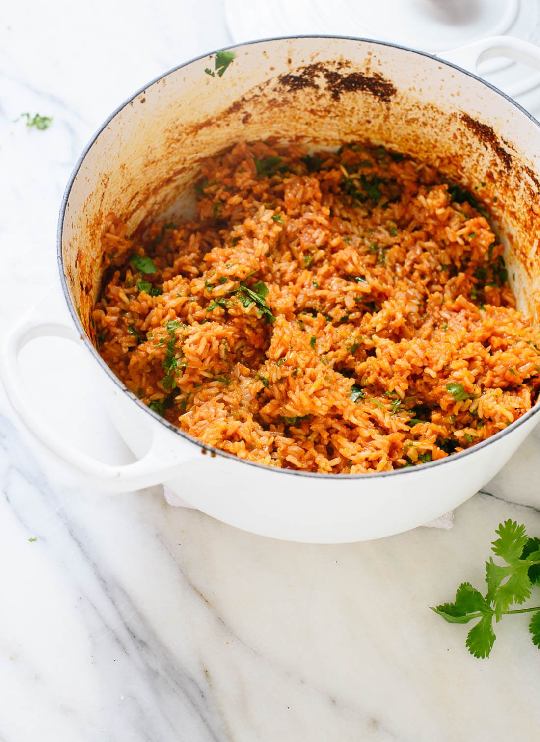 Delicious Spanish brown rice recipe - it's easy to make, just bake it all in the oven! cookieandkate.com